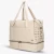 damska-torba-podrozna-ogio-rise-weekender-36l-bezowa-laptop-skos.webp